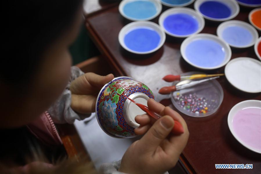 People busy making silver handicrafts for Spring Festival in Guizhou