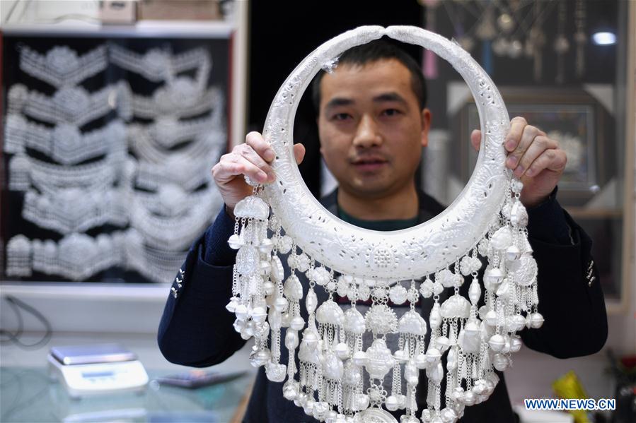 People busy making silver handicrafts for Spring Festival in Guizhou