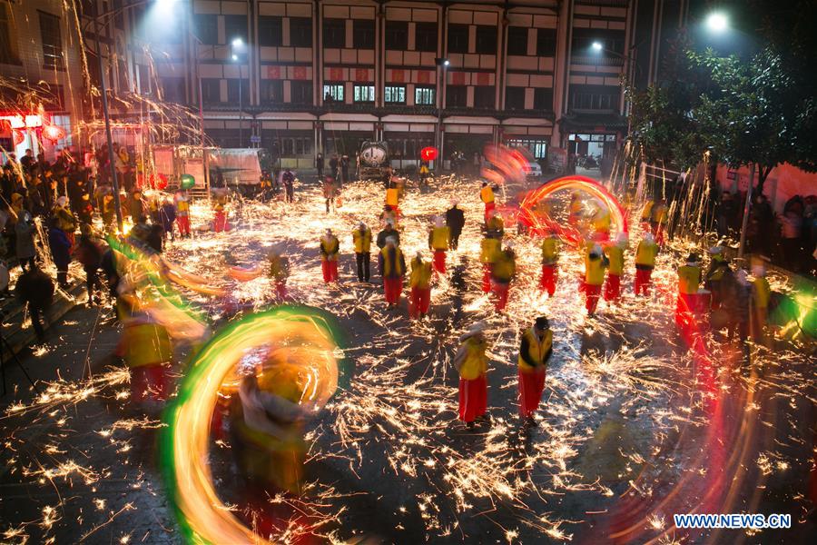 People perform dragon dance to celebrate upcoming Lantern Festival in Guizhou