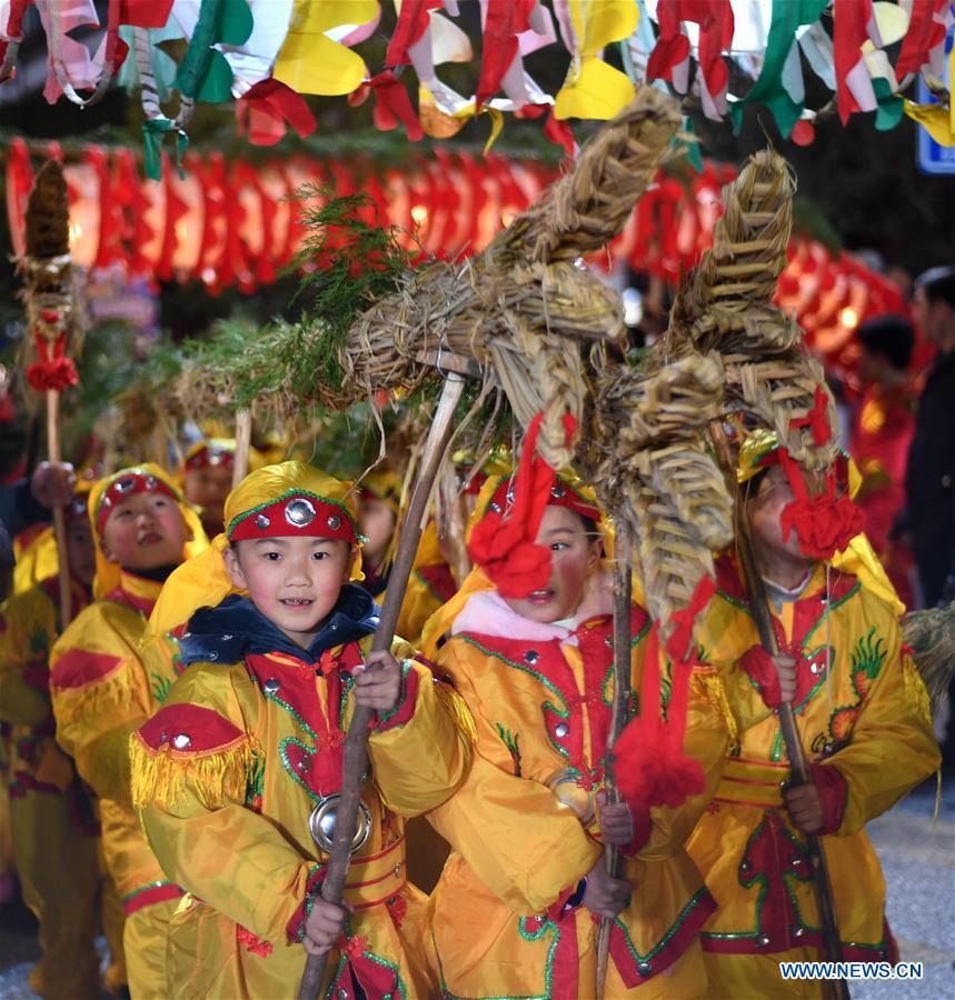 People perform dragon dance to celebrate upcoming Lantern Festival in Guizhou